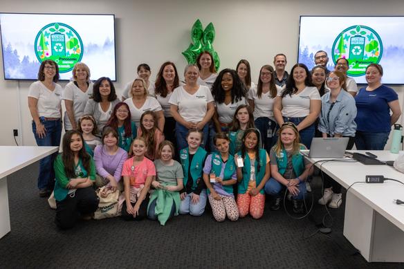 Panasonic Energy of North America (PENA) employees posing with members of the Girl Scouts of the Sierra Nevada (GSSN)